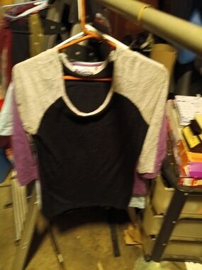 happening in the present Black, Cream and Purple Raglan Tee
